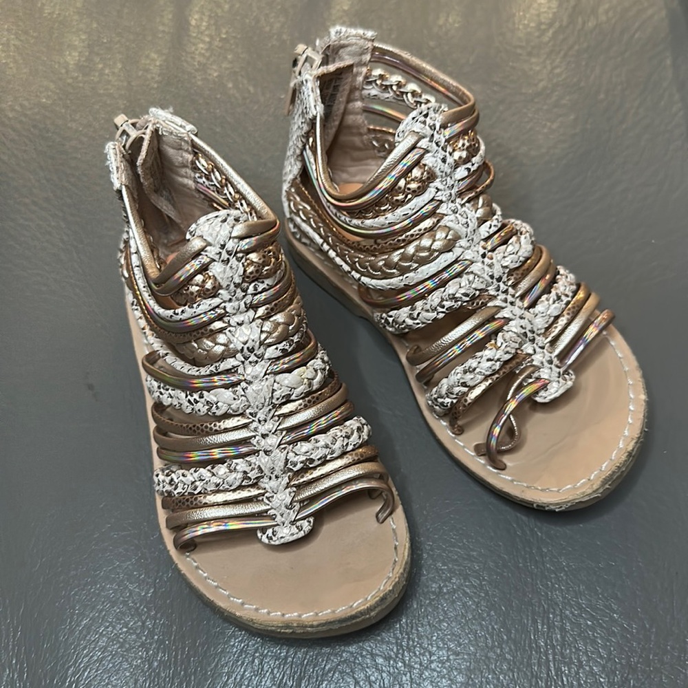 Gold gladiator sandals for a toddler girl